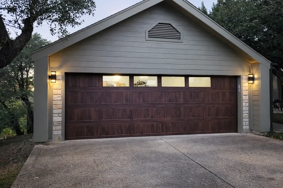 New wide brown garage door after the two-to-one conversion