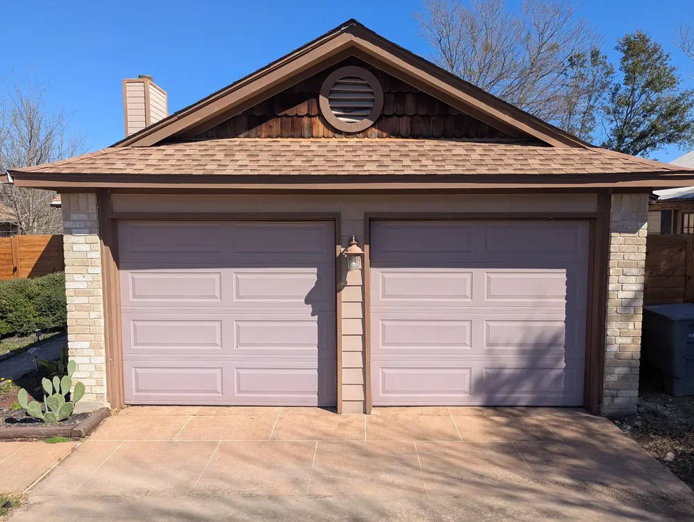 Two narrow garage doors before conversion — Cedar Park TX