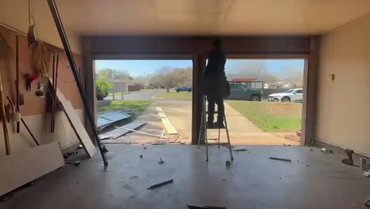 One wide garage door finished in a single day where two single doors used to be - Edge Garage Doors two-to-one conversion in Austin