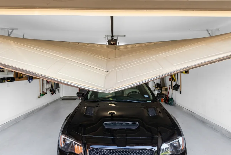 Garage door off-track repair in progress — Cedar Park TX