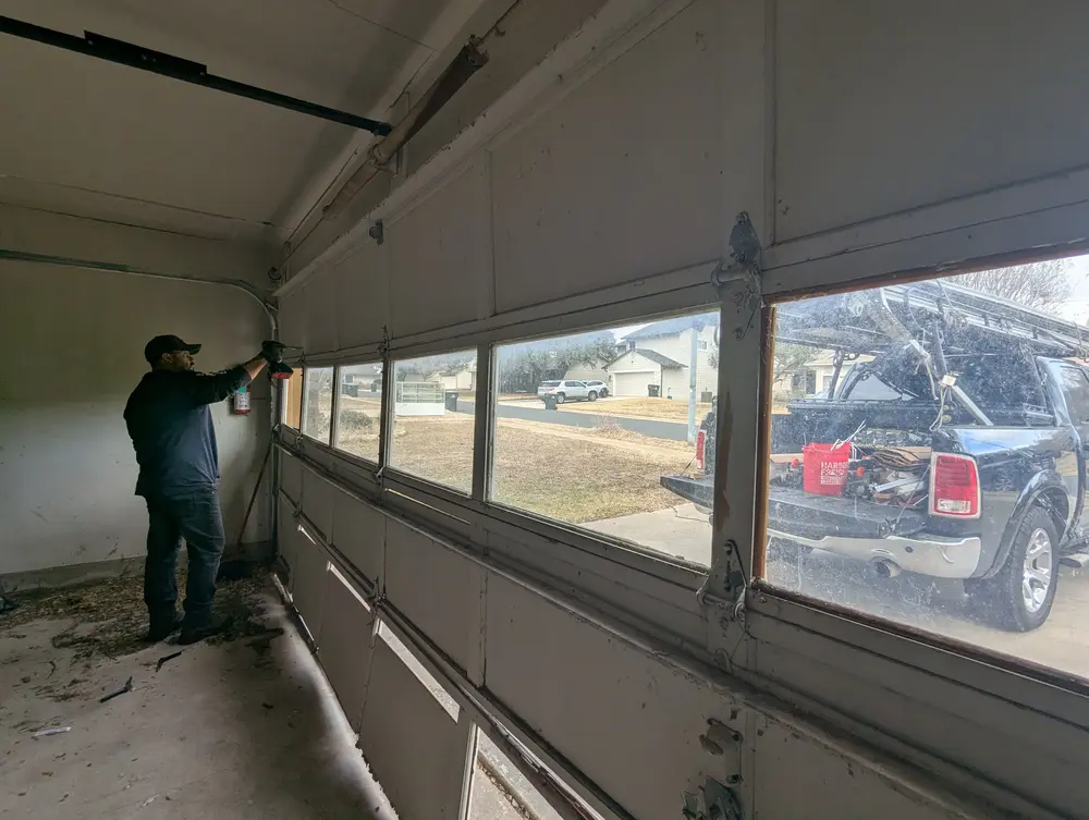 Edge Garage Doors technician performing a garage door tune-up