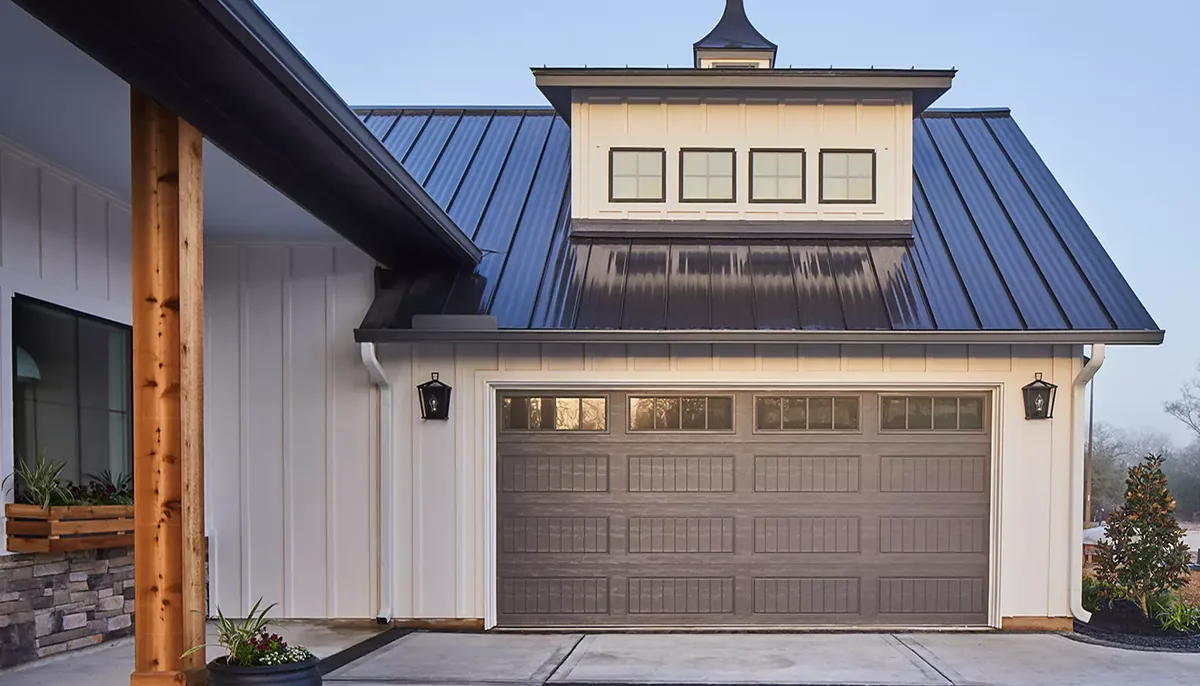 Steel long-panel garage doors on a custom home